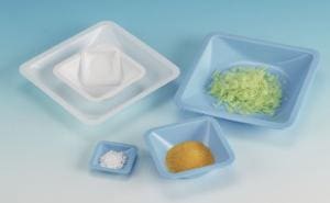Set of blue ceramic serving dishes with various condiments and sauces.